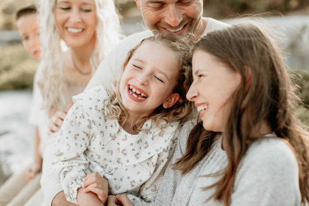 Family laughing together during a family photo session 