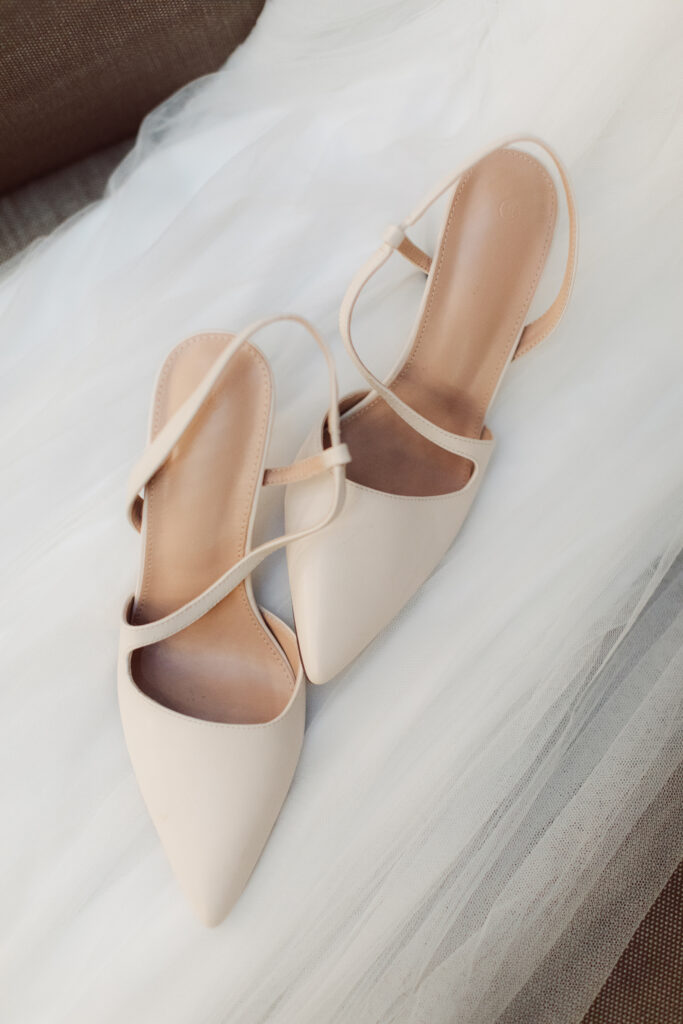 Bridal shoes on veil.