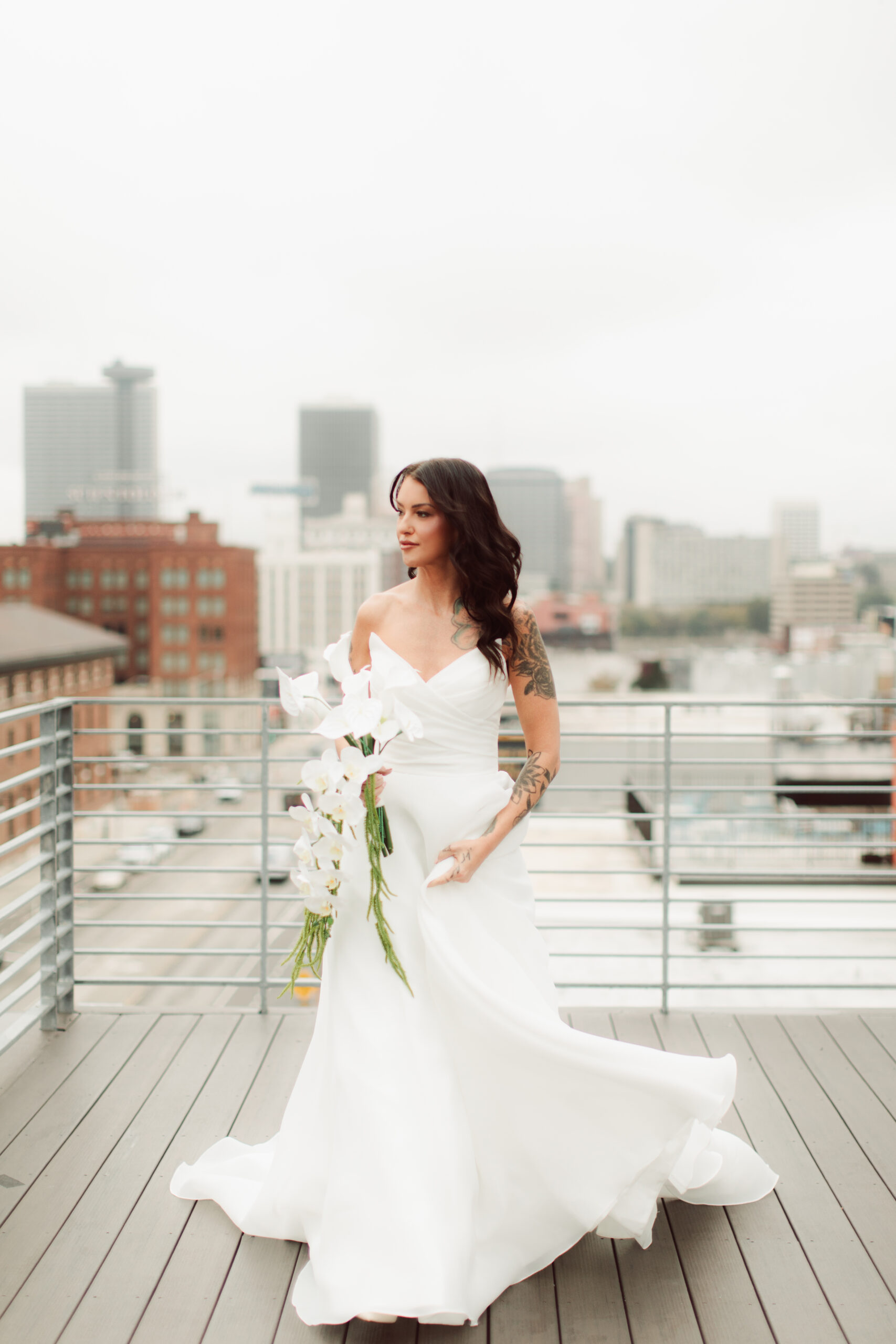 Bride in her wedding dress on a rooftop