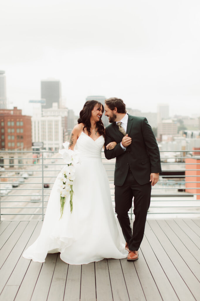 Modern bride and groom on rooftop.