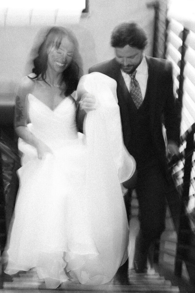 bride and groom walking down stairs