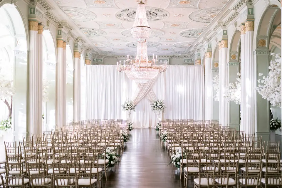 Ceremony setup inside The Biltmore Ballrooms Atlanta wedding venue featuring crystal chandeliers, grand columns, and elegant historic ballroom in Midtown Atlanta Georgia