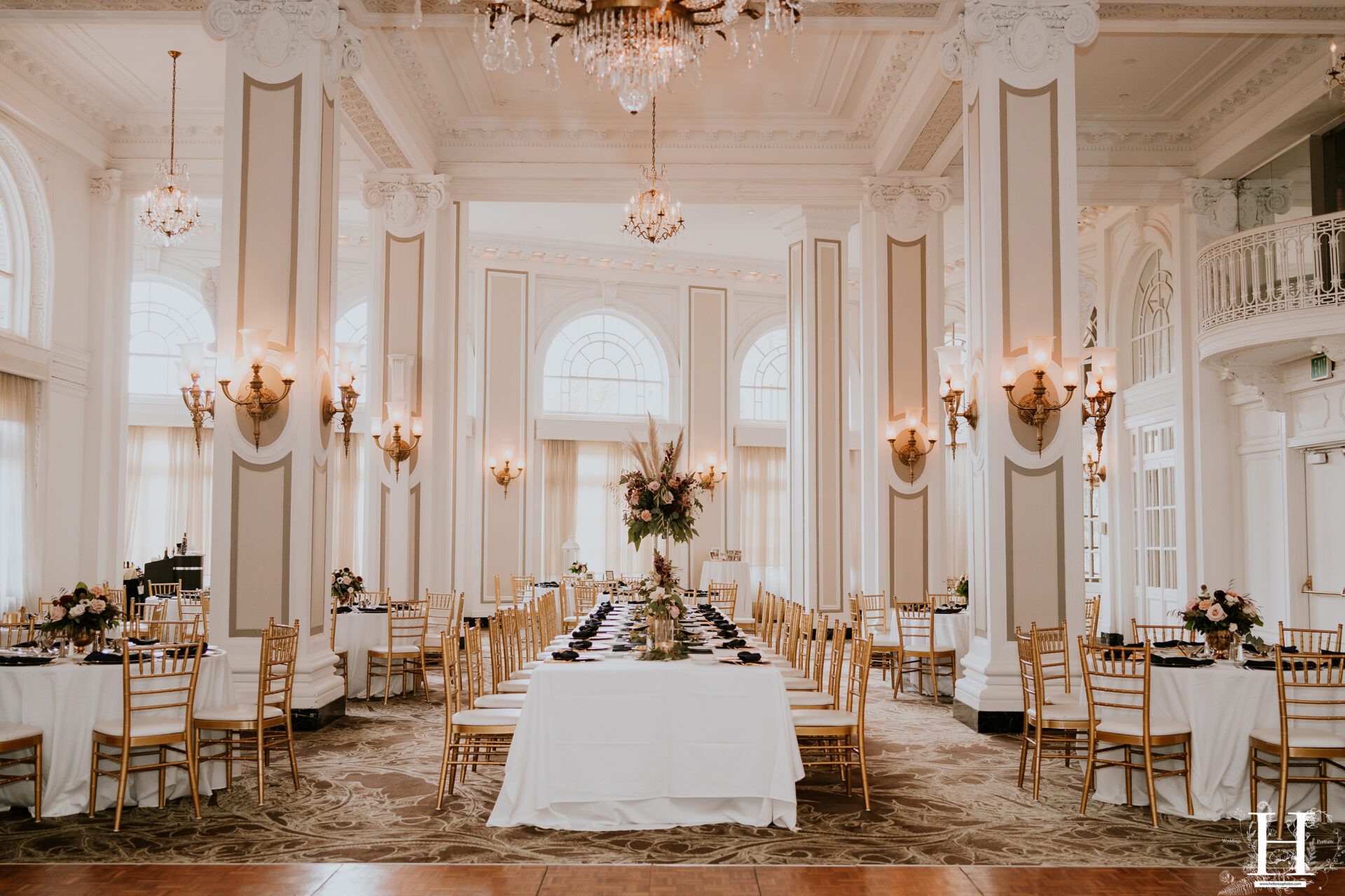 Reception setup inside The Georgian Terrace Atlanta wedding venue featuring grand ballroom, tall columns, chandeliers, and elegant historic architecture in Midtown Atlanta Georgia