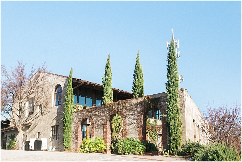 Exterior of Summerour Studio Atlanta wedding venue featuring Italian villa architecture, stone walls, and cypress trees in Atlanta Georgia