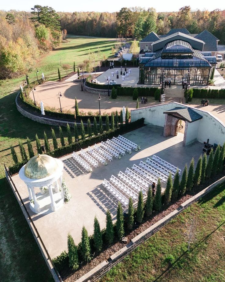 Outdoor ceremony courtyard at The Conservatory at Blackberry Ridge wedding venue featuring gazebo, white chairs, and luxury estate setting in Georgia