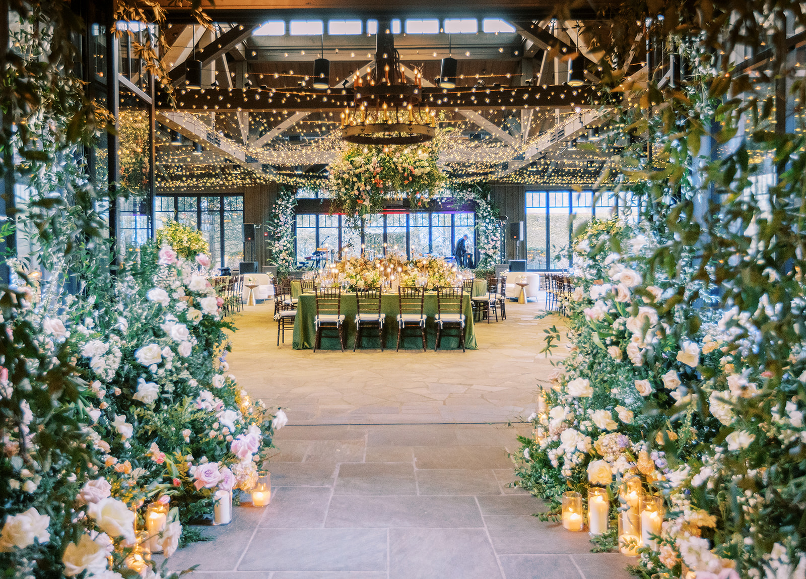 Luxury reception setup at The Farm at Old Edwards wedding venue featuring floral installations, candlelight, and elegant mountain estate reception space